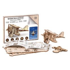 Shows the box, assempled biplane and instructional manual