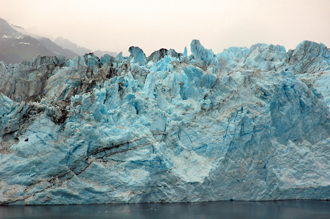 Shows some beautiful ice bergs to illustrate the solid form of water