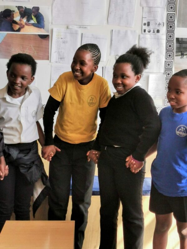 Shows a group of smiling students to illustrate the topic which is the secred to good learning